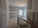 Bedroom under construction featuring drywall, a window with natural light, and a door at 6851 Phillips Mill Rd, Douglasville, GA 30135