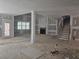 Open-concept living area during construction, featuring a fireplace and staircase at 6851 Phillips Mill Rd, Douglasville, GA 30135