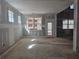 Spacious living room under construction with large windows, natural light, and access to the outdoors at 6851 Phillips Mill Rd, Douglasville, GA 30135
