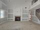 Living room under construction featuring a modern fireplace with shiplap detailing and a staircase to the upper level at 6851 Phillips Mill Rd, Douglasville, GA 30135