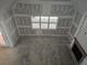 The unfinished living room has a fireplace and a window at 6851 Phillips Mill Rd, Douglasville, GA 30135