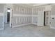 Spacious main bedroom under construction with ensuite bathroom and walk-in closet at 6851 Phillips Mill Rd, Douglasville, GA 30135