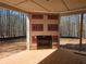 Covered patio with fireplace and wooded backyard at 6851 Phillips Mill Rd, Douglasville, GA 30135