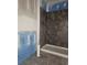 Corner of a gray tiled shower with a white base at 6851 Phillips Mill Rd, Douglasville, GA 30135