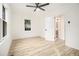 Bright bedroom features light floors, a ceiling fan, and access to ensuite bathroom at 2736 Joyce Ave, Decatur, GA 30032