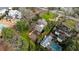 An aerial view shows the property nestled among lush trees, with a pool and manicured lawns adding to its appeal at 3180 Arden Nw Rd, Atlanta, GA 30305