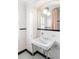 Classic bathroom with a pedestal sink, black and white tile, and natural light at 3180 Arden Nw Rd, Atlanta, GA 30305