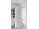 Classic bathroom with a shower-tub combo, black and white tiled floor, and a window at 3180 Arden Nw Rd, Atlanta, GA 30305