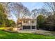 Beautiful two-story brick home featuring an attached two-car garage and a meticulously landscaped front yard at 3180 Arden Nw Rd, Atlanta, GA 30305