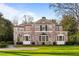 Beautiful brick home featuring arched windows and a well-maintained lawn for great curb appeal at 3180 Arden Nw Rd, Atlanta, GA 30305