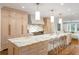 Bright, spacious kitchen with marble countertops, a large island, and modern stainless steel appliances at 3180 Arden Nw Rd, Atlanta, GA 30305