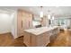 Kitchen featuring marble countertops, large island with seating, and stainless steel appliances at 3180 Arden Nw Rd, Atlanta, GA 30305