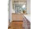 Elegant kitchen with a mirrored backsplash, brass hardware, and herringbone wood floors at 3180 Arden Nw Rd, Atlanta, GA 30305