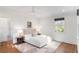 Bright bedroom featuring neutral tones, wood floors, and a geometric area rug at 3180 Arden Nw Rd, Atlanta, GA 30305