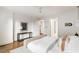 Bright bedroom featuring neutral tones, wood floors, and modern decor and furnishings at 3180 Arden Nw Rd, Atlanta, GA 30305