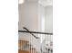 Bright white staircase with dark railing and natural light at 3180 Arden Nw Rd, Atlanta, GA 30305