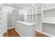 Large walk-in closet with custom shelving, drawers, and organization spaces at 3180 Arden Nw Rd, Atlanta, GA 30305