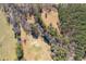 Aerial view of property with large land area and trees at 446 Mcgukin Rd, Bremen, GA 30110