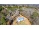 Aerial view of property showing house and wooded acreage at 446 Mcgukin Rd, Bremen, GA 30110