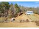 Aerial view of house and expansive lot with wooden fence at 446 Mcgukin Rd, Bremen, GA 30110