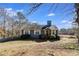 Blue Ranch style home with a yard and wooded lot at 446 Mcgukin Rd, Bremen, GA 30110