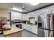 Kitchen with island, stainless steel appliances, and white cabinets at 446 Mcgukin Rd, Bremen, GA 30110