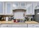 Kitchen with white cabinets and wood countertops at 446 Mcgukin Rd, Bremen, GA 30110