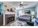 Living room with fireplace and ceiling fan at 446 Mcgukin Rd, Bremen, GA 30110