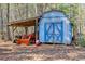 Large storage shed with tractor and other equipment at 446 Mcgukin Rd, Bremen, GA 30110