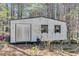 Small white storage shed in the woods at 446 Mcgukin Rd, Bremen, GA 30110