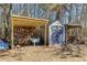 Storage shed and woodpile with covered storage area at 446 Mcgukin Rd, Bremen, GA 30110