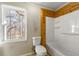 Bathroom with shower/tub combo and wood-paneled walls at 12205 Highway 36, Covington, GA 30014