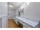 Bathroom with laminate vanity and shower/tub combo at 12205 Highway 36, Covington, GA 30014