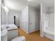 Main bathroom with a tub, shower, and vanity at 12205 Highway 36, Covington, GA 30014