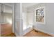 Bathroom features a shower and a window with natural light at 12205 Highway 36, Covington, GA 30014