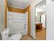 Main bathroom with shower/tub and view into another room at 12205 Highway 36, Covington, GA 30014