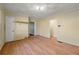 Bedroom with hardwood floors and access to hallway at 12205 Highway 36, Covington, GA 30014