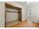 Walk-in closet with wood shelving and carpeted floor at 12205 Highway 36, Covington, GA 30014