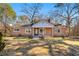 Brick ranch house with covered porch and spacious yard at 12205 Highway 36, Covington, GA 30014