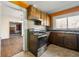 Kitchen boasts stainless steel appliances and wood cabinets at 12205 Highway 36, Covington, GA 30014