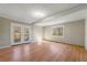 Spacious living room with hardwood floors and access to deck at 12205 Highway 36, Covington, GA 30014