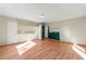 Large living room featuring hardwood floors and built-in shelving at 12205 Highway 36, Covington, GA 30014
