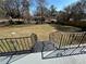 Large backyard with grassy area and a black metal fence at 1902 E Piedmont Rd, Marietta, GA 30062