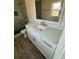 Bathroom boasts a white vanity with quartz countertop at 1902 E Piedmont Rd, Marietta, GA 30062