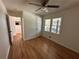 Bright bedroom featuring hardwood floors and ceiling fan at 1902 E Piedmont Rd, Marietta, GA 30062