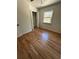 Hardwood floor bedroom with closet and window at 1902 E Piedmont Rd, Marietta, GA 30062