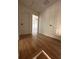 Hardwood floor hallway with doors to bedrooms at 1902 E Piedmont Rd, Marietta, GA 30062