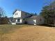 Side view of the home showcasing the rear exterior and landscaping at 1902 E Piedmont Rd, Marietta, GA 30062