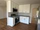 Modern kitchen with stainless steel appliances and granite countertops at 1902 E Piedmont Rd, Marietta, GA 30062