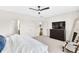 Bedroom with neutral carpet, dark dresser, and views to the bathroom and stairs at 204 Dawson Dr, Woodstock, GA 30188